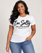 Black woman modeling the I’m Salty Tee in white, front view